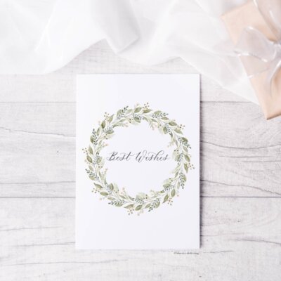 Best Wishes card Best Wishes card staged on white wood background with tulle and kraft wrapped present. Card features "Best wishes" written in calligraphy and watercolor wreath