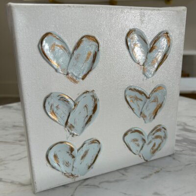 White and blue and gold painted hearts
